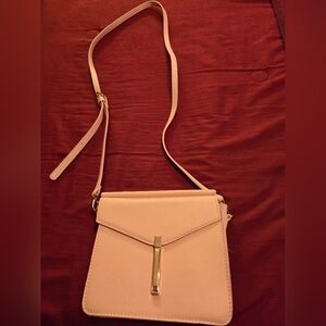 Beautiful small, light pink purse with long strap. Like new.